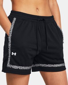 the under armour shorts are black and white with an abstract print on the side, along with a drawstring waist