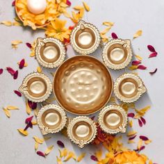 an overhead view of a gold plate surrounded by flowers