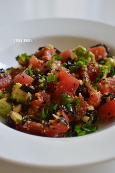 a white bowl filled with chopped up vegetables