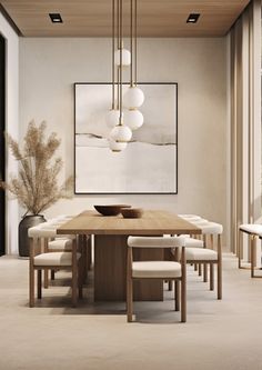 a dining room with a table, chairs and art on the wall above it that is framed in wood