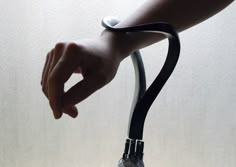 a person is holding onto a stethoscope with their hand on the handle