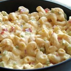 macaroni and cheese is mixed together in a dish