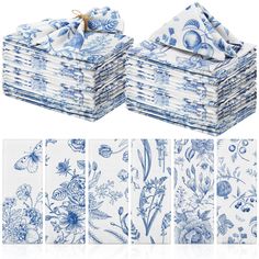 a stack of blue and white napkins with flowers on them