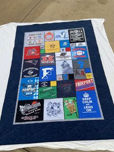 there is a quilt made to look like it has many different t - shirts on it