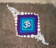 a painting on the side of a building with an omastha symbol painted on it