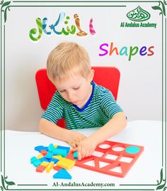 a young boy playing with shapes on a table