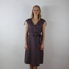 "Spring dress, Write the selected color in the message Handmade wrap dress with belt and 2 pockets , perfect for casual wear and suitable for any occasion in any season Details: - 100% natural linen produced in Europe ; - medium weight (180 gram per square meter); - color: dark taupe, could be any from our colors catalog (color samples at the photo); Made to order, approximately a few days, If you have any questions please message me and I will be glad to answer. Size guide : Size XS Bust: fits Summer Linen V-neck Dress With Tie Waist, Linen Dress With Tie Waist, Knee-length Linen Dress With Tie Waist, Summer Beach Belted Dress With Tie Waist, Linen Vacation Dress With Tie Fastening, Casual Linen V-neck Wrap Dress, Vacation Linen Dress With Tie Fastening, Linen Dress With Tie Fastening For Vacation, Belted Wrap Dress For Summer