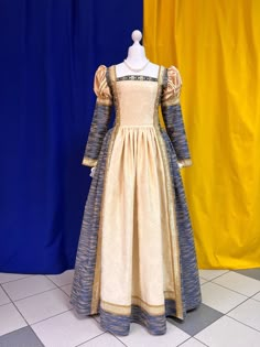 This dress is a striking example of the Italian fashion of the 16th century. The dress will be perfectly suitable for photographing, a performance or a historical ball. As fabric it is used a cotton, but in two patterns and colorses. The dress is decorated with both golden and woven braid. The fastener is on a back-it is a lacing. Thanks to it, the dress ideally fits to the shape and there is the opportunity to adjust the size. The suit consists of a dress. Material: cotton, satin. We have this 1600s Dress, 1600s Dresses, 15th Century Dress, 16th Century Dress, 19th Century Dresses, Italian Dresses, 16th Century Fashion, Ren Faire Outfits, Century Dress