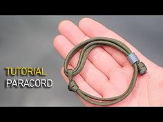 an image of a hand holding a green snake in it's right hand with the words, how to make a paracord