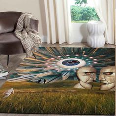 a living room area rug with an artistic painting on it