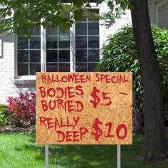 a sign in front of a house that says halloween special bodies buried really deep $ 10