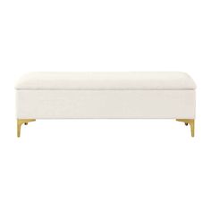 a white bench with gold legs and a foot rest on the bottom shelf, against a white background