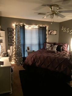 a bedroom decorated with christmas lights and decorations