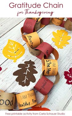 a paper chain with words on it that say, i am thanksgiving and have leaves cut out