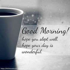 a cup of coffee sitting on top of a table next to a window with the words good morning hope you slept well, hope your day is wonderful