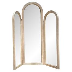 an arched wooden mirror is shown against a white background with the reflection of two mirrors in it