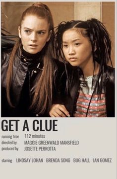 two girls with dreadlocks are posing for the camera in front of a poster