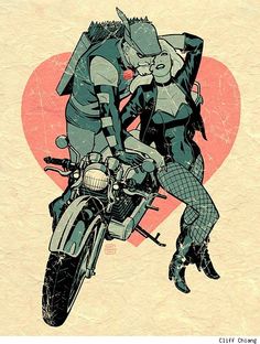 two people riding on the back of a motor bike in front of a red heart