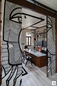 an artisticly designed room divider in the shape of a woman's face