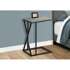 the end table is made from metal and wood