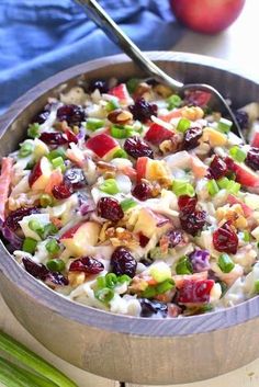 a bowl filled with fruit and nuts on top of a table