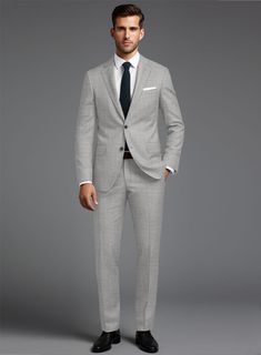 Build your elegant custom wardrobe with our Stretch Light Gray Wool Suit. Crafted from a wool blend, the suit has a smooth finish and is versatile enough to provide you a modern look and confident demeanor, also an ideal pick for any important occasion.  
 
 Look Includes  Stretch Light Gray Wool Fabric  Two Button Jacket Style  Notch Lapel  Horn Royal Black Buttons  Single Vent  Three Cuff Buttons  Two Welted Back Pockets on Trousers   You can change the look during customization if required. Classic Wool Suits For Business Casual, Classic Wool Suit For Business Casual, Timeless Wool Suits For Business Casual, Tailored Business Casual Suits With Notch Lapel, Tailored Suits With Notch Lapel For Business Casual, Tailored Notch Lapel Suits For Business Casual, Tailored Suits With Welt Pockets For Business Casual, Tailored Business Casual Suits With Welt Pockets, Classic Fitted Tuxedo For Office Wear