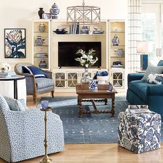 a living room with blue and white furniture