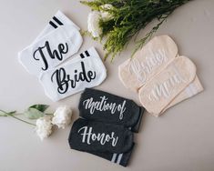 the bride and groom's personalized hand towels are laid out next to flowers