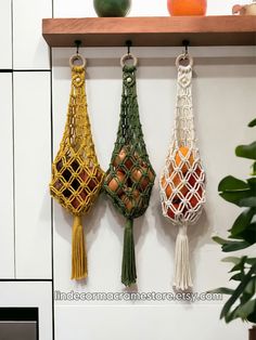 three macrament bags hanging on a wall