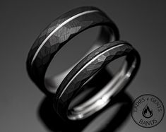 two wedding rings are shown in black and white