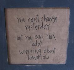 a sign that is on the side of a door saying you can't change yesterday but you can turn today writing about tomorrow