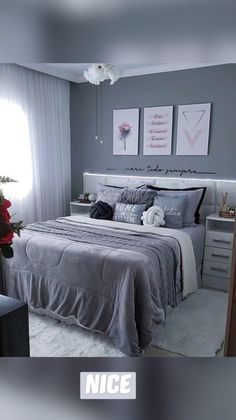 a bedroom with gray walls and white bedding