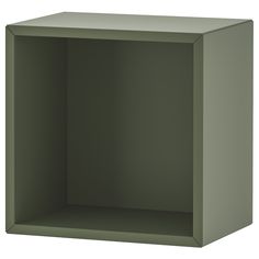 an empty green shelf is shown on a white background