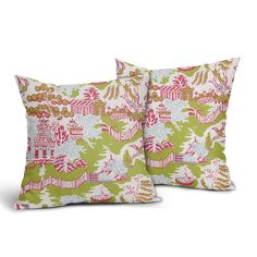 two pillows with pink and green designs on them