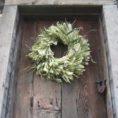 a door with a wreath hanging on it