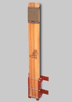 a tall wooden object with a metal handle