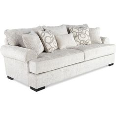 a white couch with pillows on it