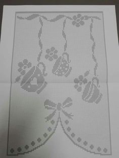 a cross stitch pattern on top of a piece of paper