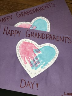 two handprints on purple paper with the words happy grandparents day