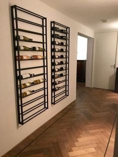 the wine rack is mounted on the wall next to the hardwood floor in this empty room