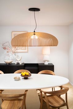 a white table with four chairs around it