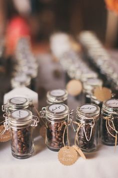 several jars filled with spices sitting on top of a table