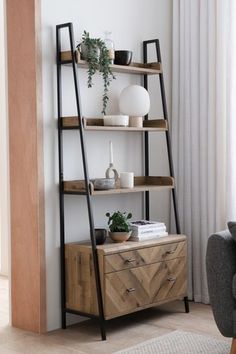 a living room with a ladder shelf next to a couch