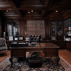 an elegant living room with wood paneling and leather furniture, along with a large rug on the floor