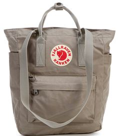 From Fjallraven&#x2C; the Kanken Convertible Totepack Backpack features: Vinylon F: 100% vinylal A tote version of Fjällräven’s iconic backpack from 1978Can be carried on the shoulder or as a backpackMade from hardwearing&#x2C; water-resistant Vinylon F fabricTop-loaded zippered main compartmentInside 13" laptop/tablet sleeve with padded baseIncludes a seat pad stored in an inside pocket in the back of main compartmentWebbing shoulder strap Fjallraven Kanken Backpack Rei, Fjallraven Kanken Inside Backpack, Affordable The North Face Backpack, Cheap Casual Backpack For Trips, Fjallraven Kanken Kawaii, Cheap Everyday Navy Backpack, Kanken Mini Whats In My Bag, Fjallraven Kanken Backpack Cheap, Affordable Everyday Bags By The North Face