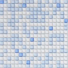 a blue and white tiled wall with squares