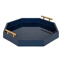 an octagonal blue tray with gold handles and two bars on each side, in the shape of a hexagon