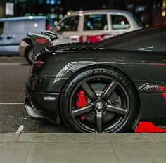 a black sports car parked on the street