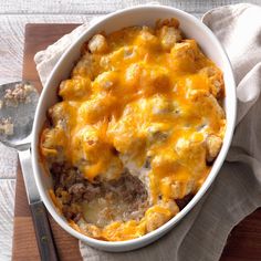 a casserole dish with meat and cheese in it