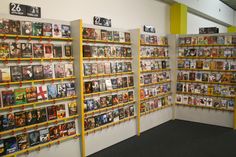 the wall is full of many different movies on display, including one for each movie